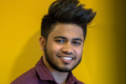 Male student smiling sunit